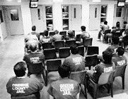 Inmates watch TV in the crowded Greene County Jail.